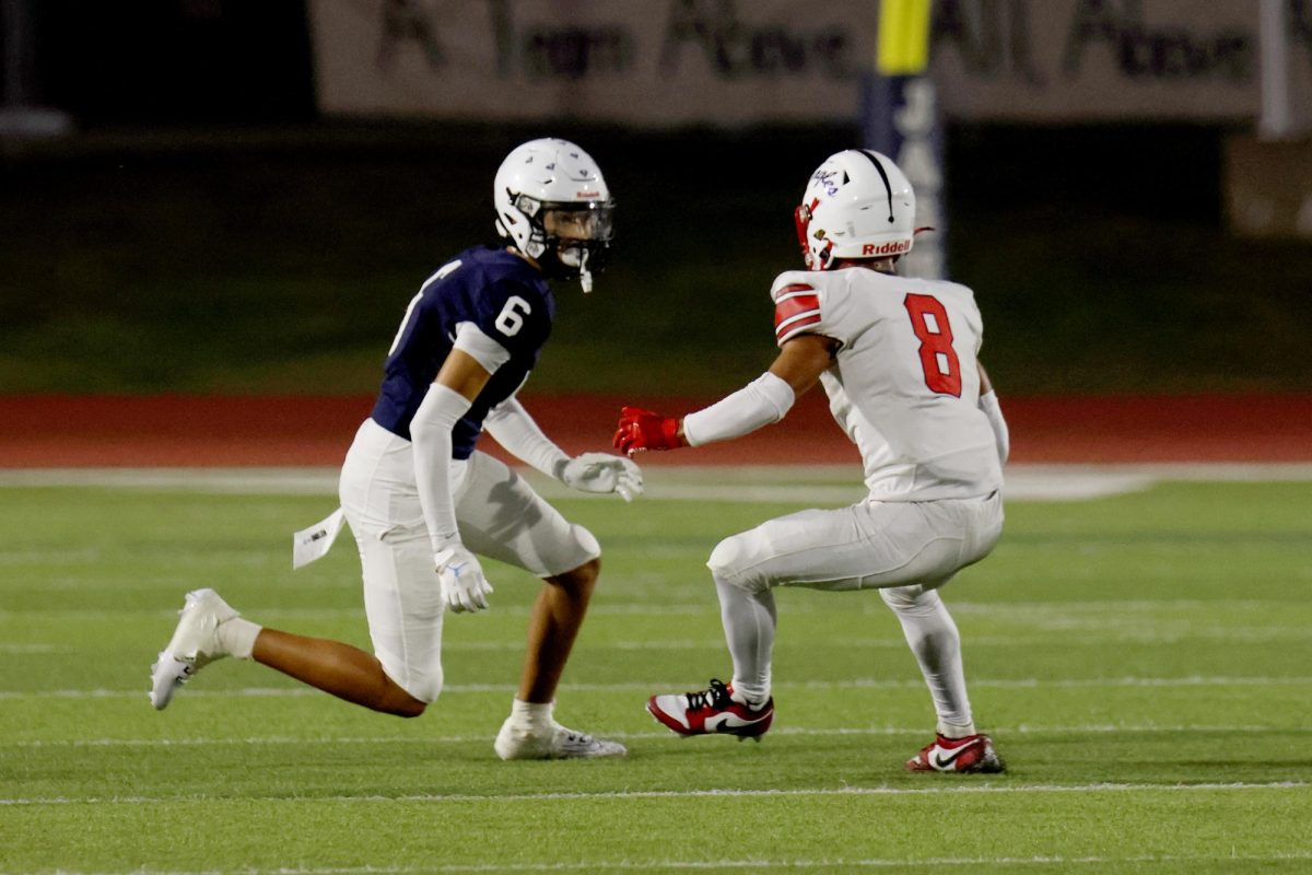 Eyes up, junior Ayden Mosley runs around the opponent.
