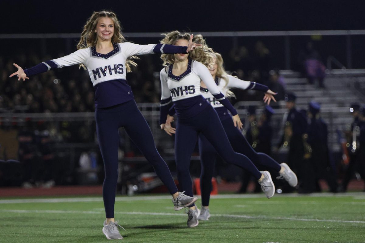 Junior Ella Jones dances to the beat of the music as she leads the Silver Stars in their hip-hop routine.