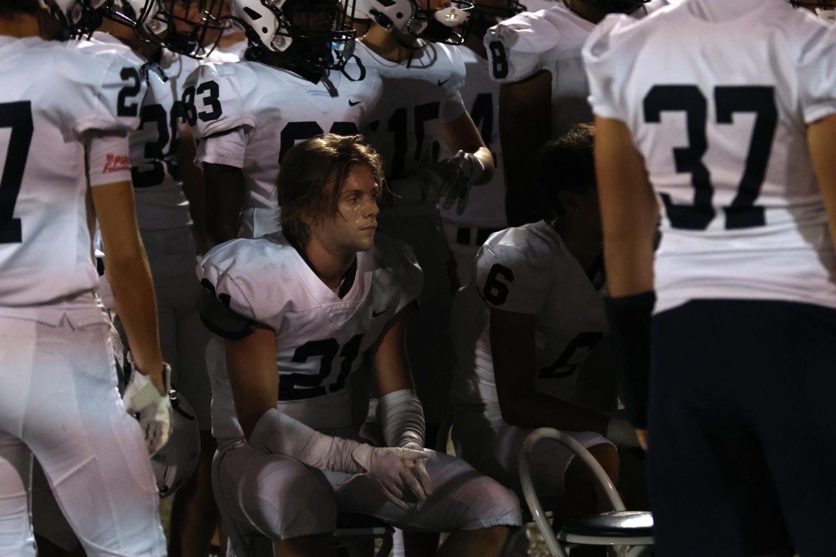 Staying in the zone, senior Clayton Sondgeroth listens to his coaches.