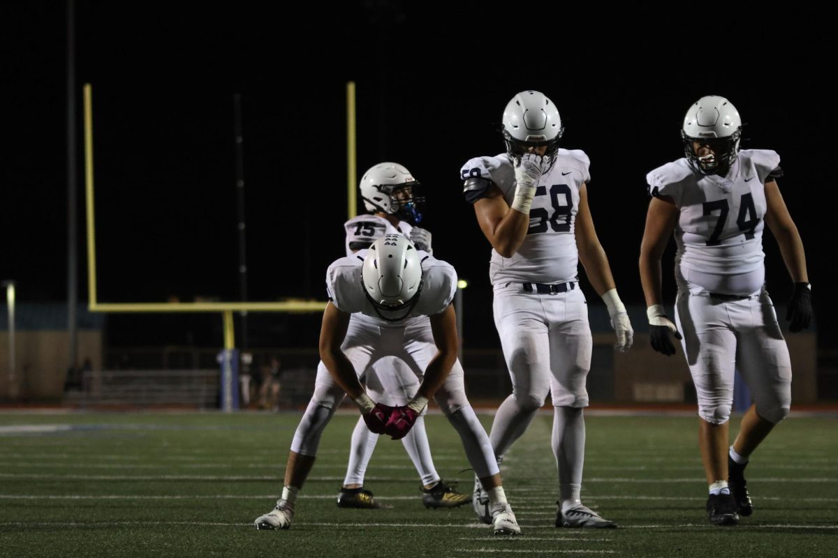 Seniors Andrew Watts, Abe Shaffer, Isaac Sauder and junior Lamarcus Barber line up for their next play.