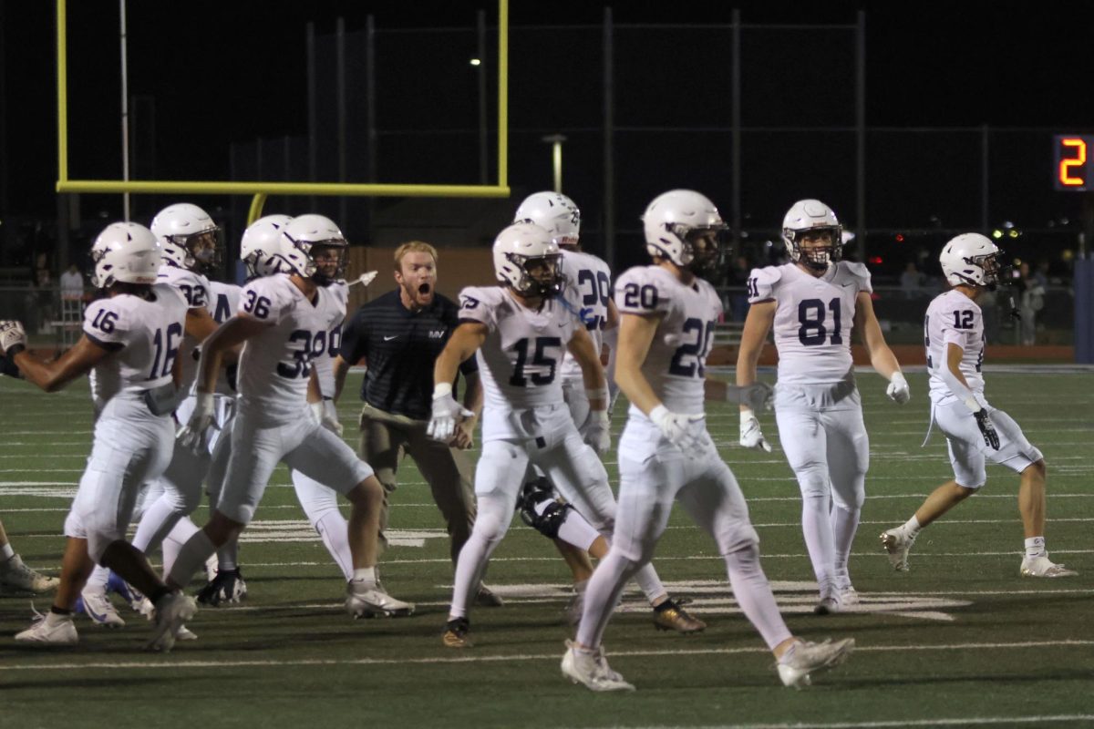 Coach ... and the team celebrate their first down.