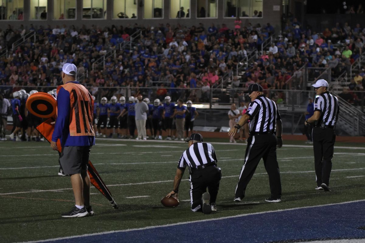 At the football game on Friday, the refs closely examine where the ball was left off.