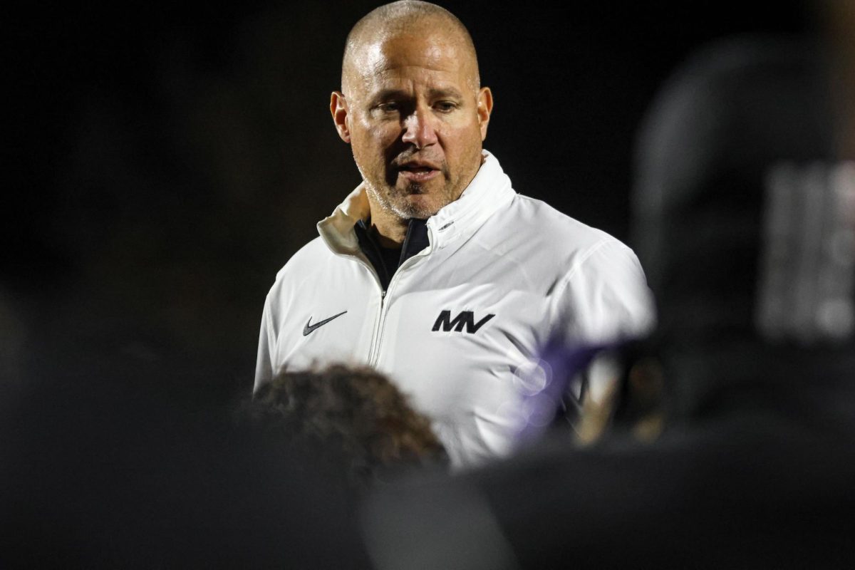 Addressing the team, head coach Joel Applebee gives his post game speech.