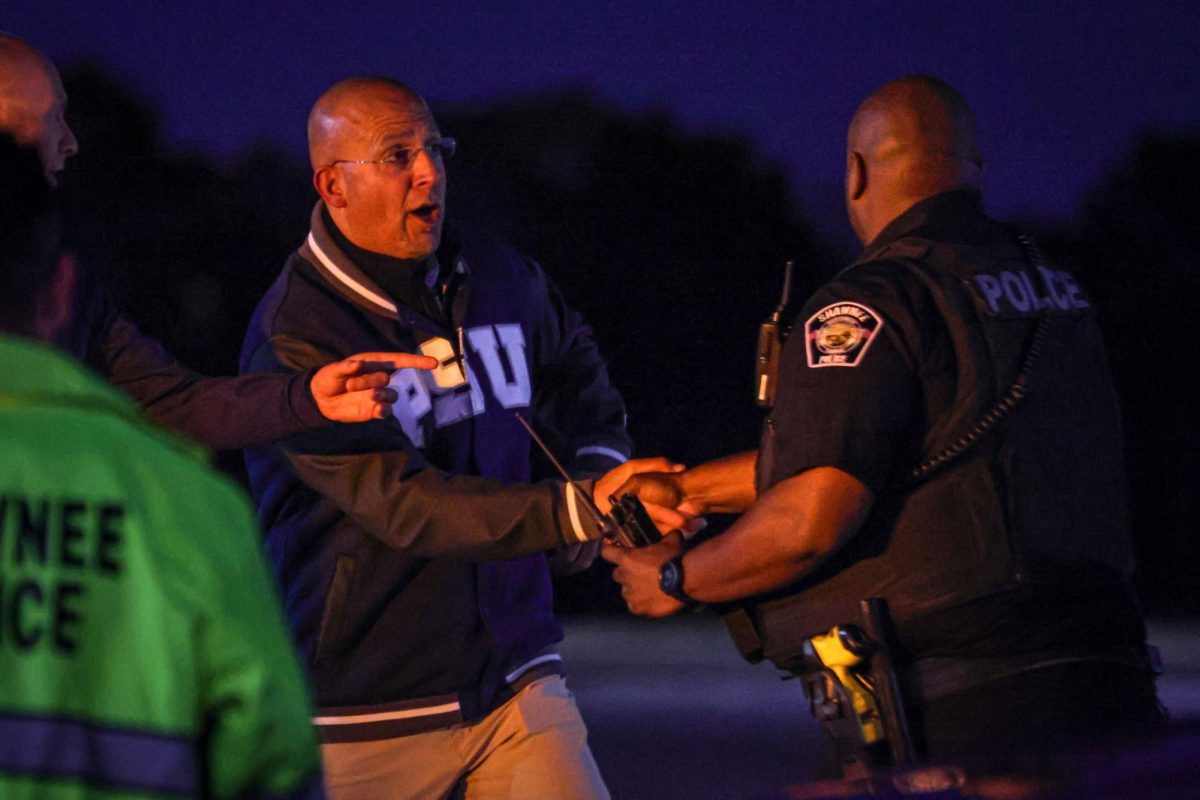 After landing in a helicopter, Penn State Football’s head coach James Franklin shakes School Resource Officer Darion Hillman’s hand.