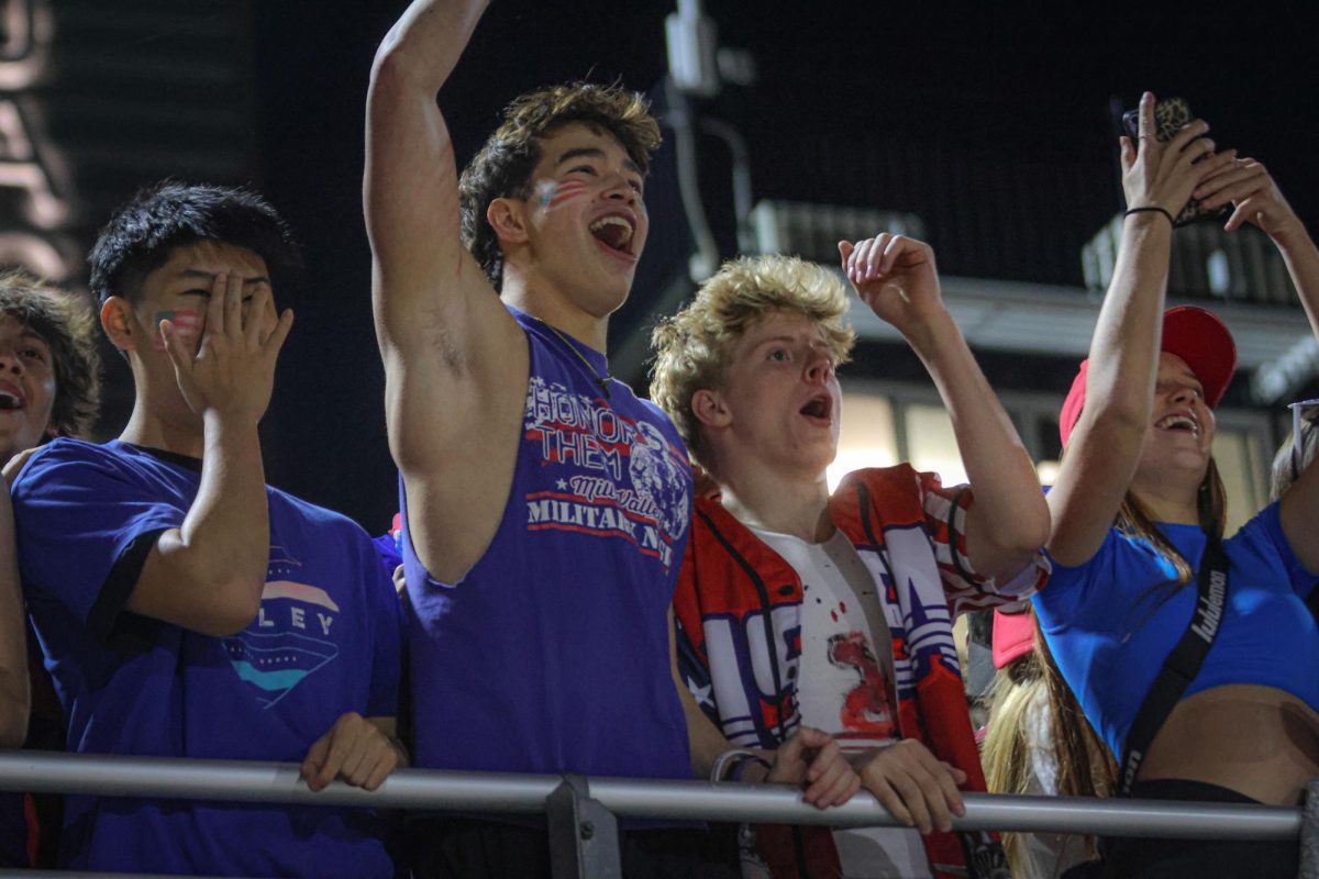 Hands in the air, seniors Noah Pham and Colton Bendure do the "party" chant.