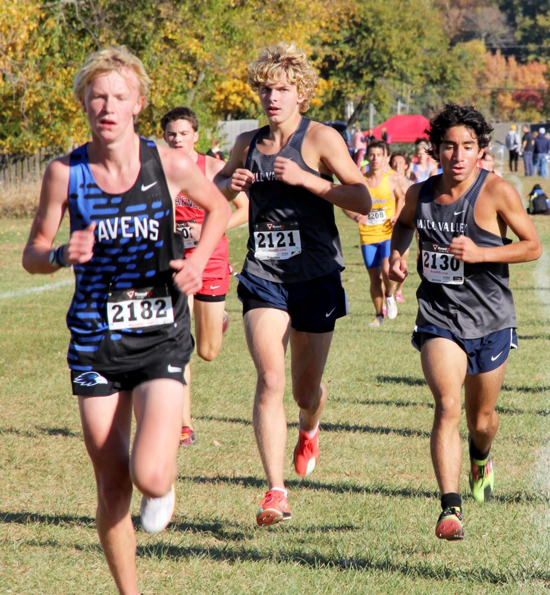 Powering through the middle of the course, sophomore Graham Anderson and junior Yazid Vazquez catch up to their opponent. 
