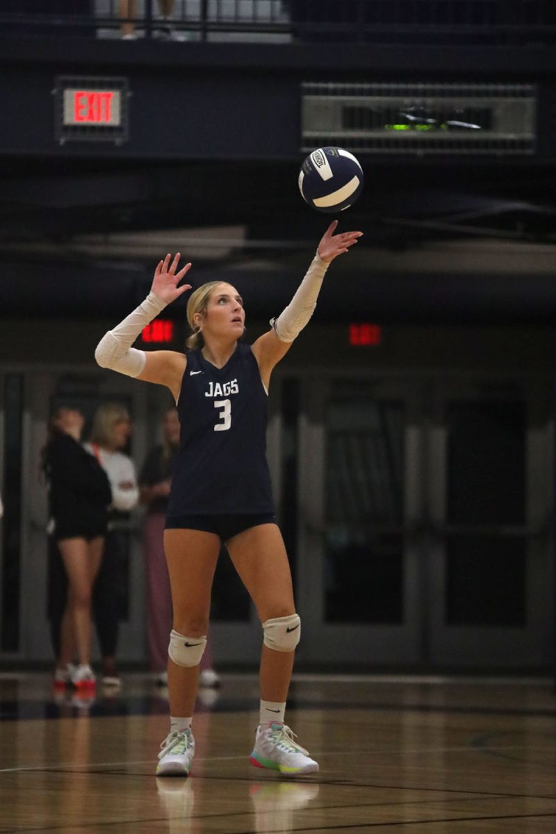 Focusing on the ball, senior Remi Ziebell gets ready to serve the ball over the net Wednesday, Oct. 2. 
