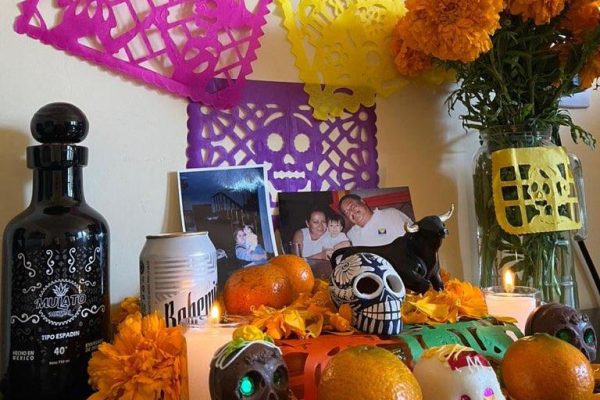 An ofrenda set up in her house, sophomore Natalia Castillejos- Ramirez has pictures, fruits, flowers and decorations to honor her past family members.