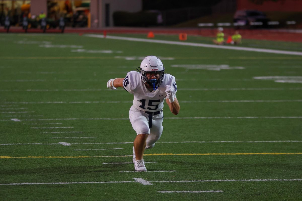 Senior Andrew Watts jumps off the line to start his route.