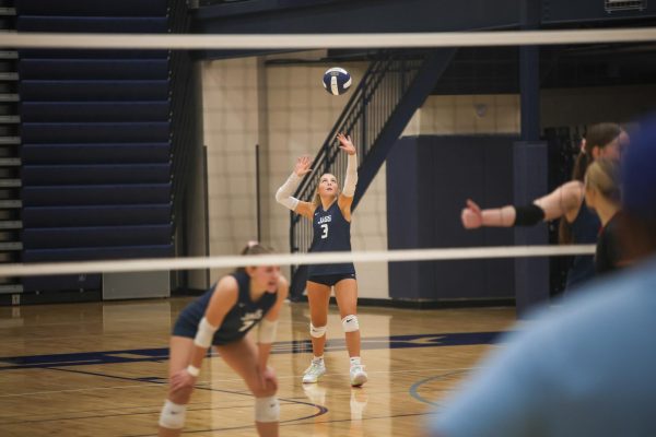 Senior Remi Ziebell prepares to serve the ball, hoping for an ace, Thursday Oct. 10. 