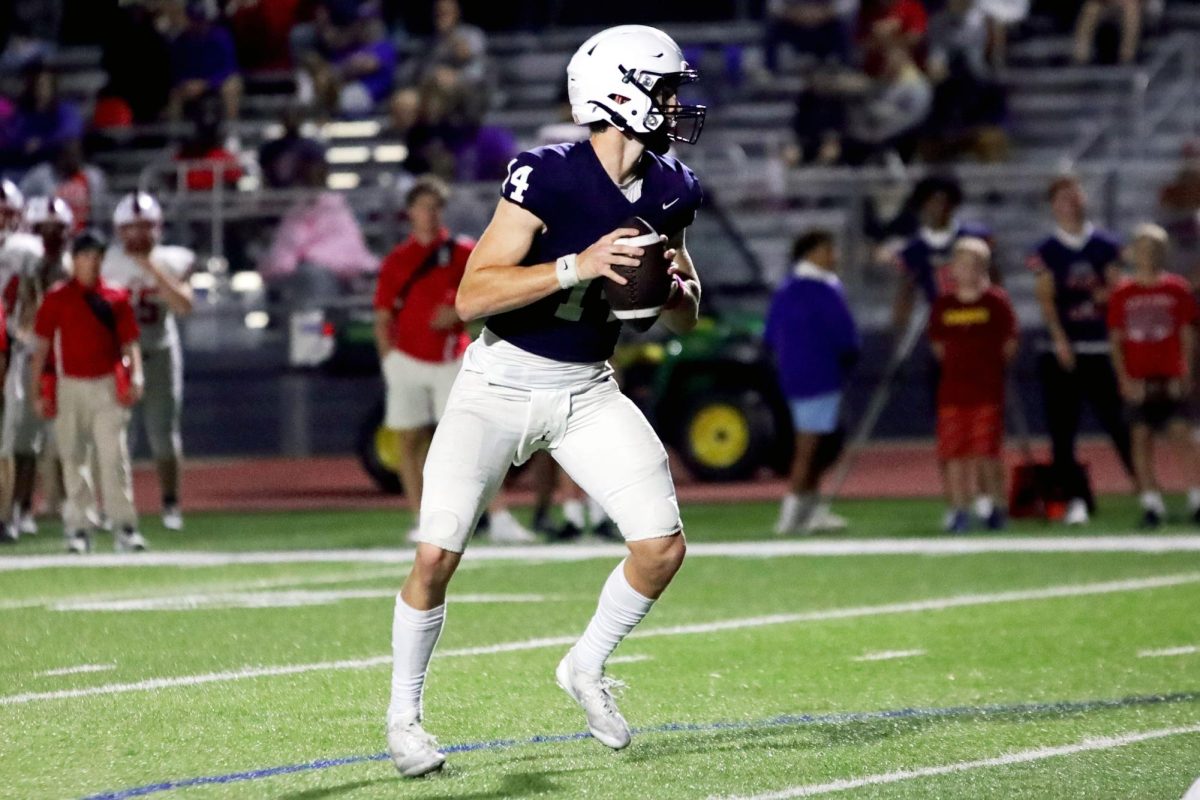 Senior Connor Bohon prepares to throw the ball during a play.