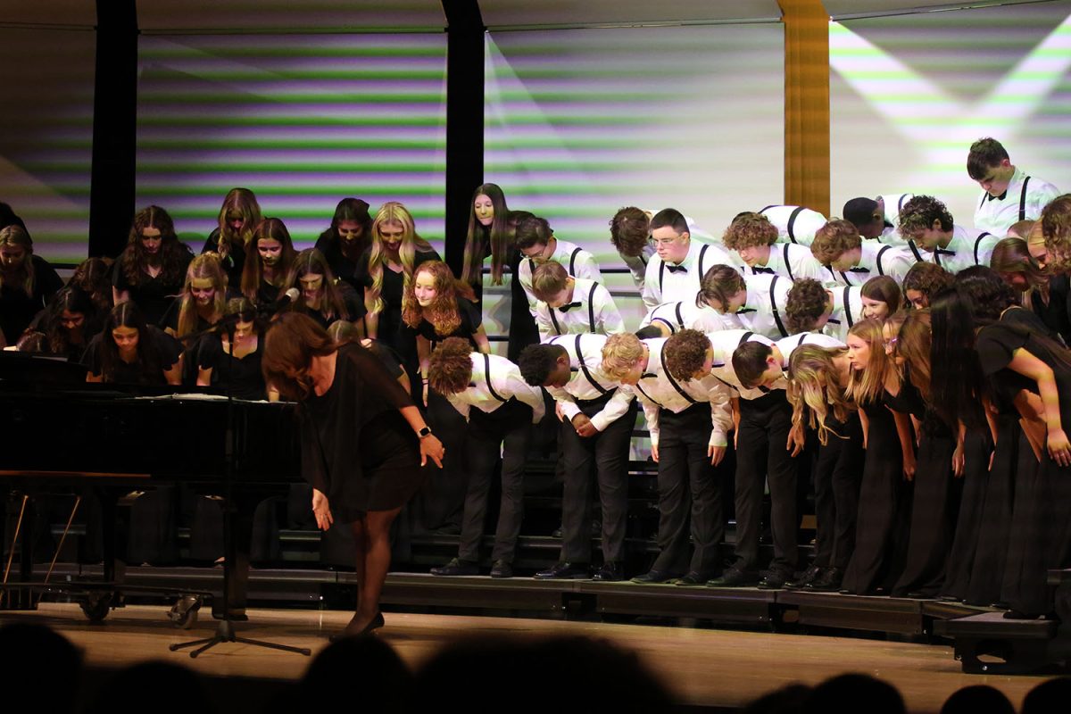 Bowing for the audience, the Grace Notes and Tenor and Bass choir end their performances. 
