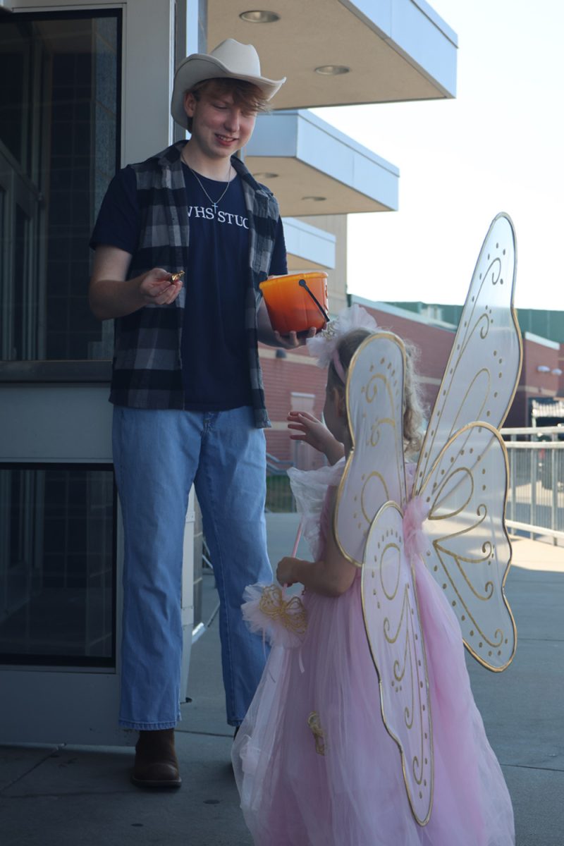 A fairy princess is welcomed by senior Logan Koester into Haunted Halls. 