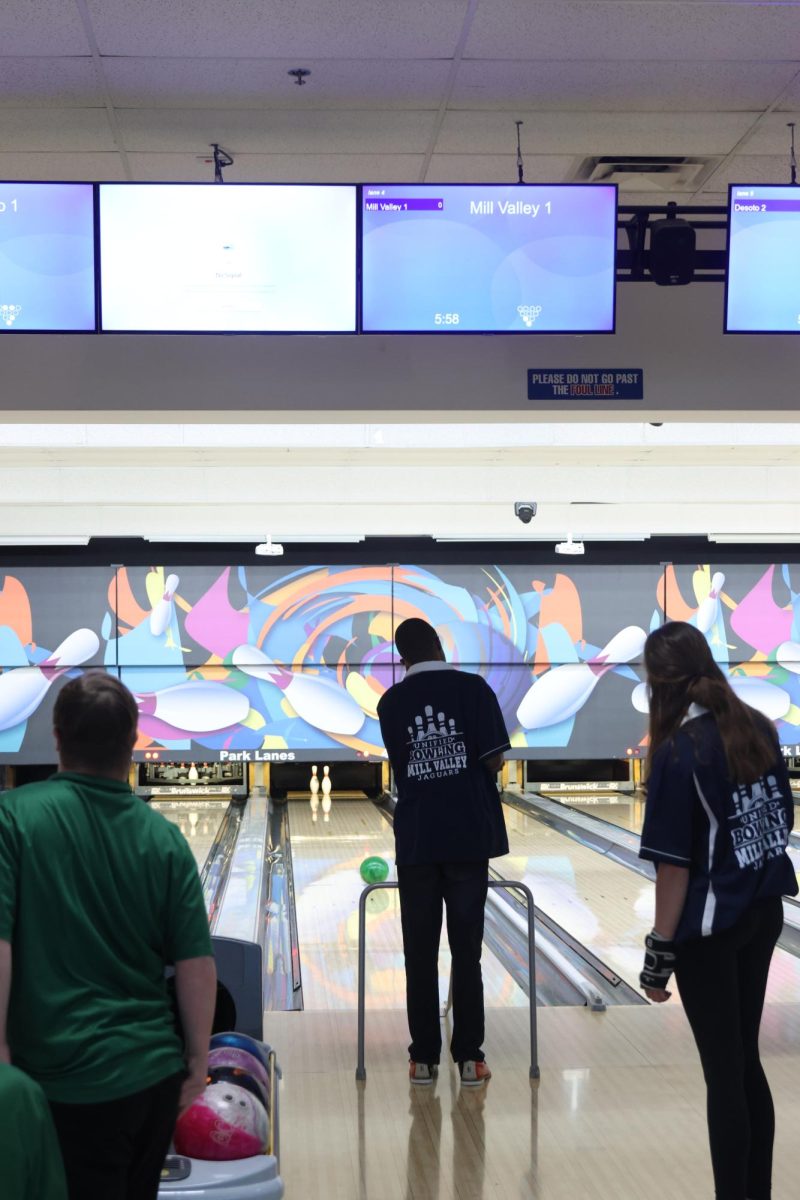 Senior Adairius Newton watches as the ball rolls down the lane toward the pins, on Wednesday Nov. 6.  