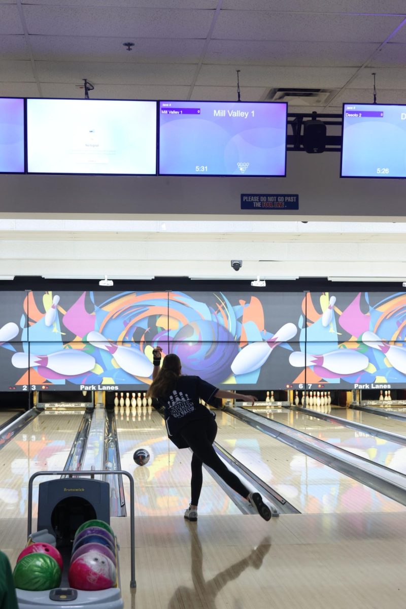 Kicking her leg back, junior Layla Gonzalez watches as her ball rolls down the lane, Wednesday Nov. 6. 