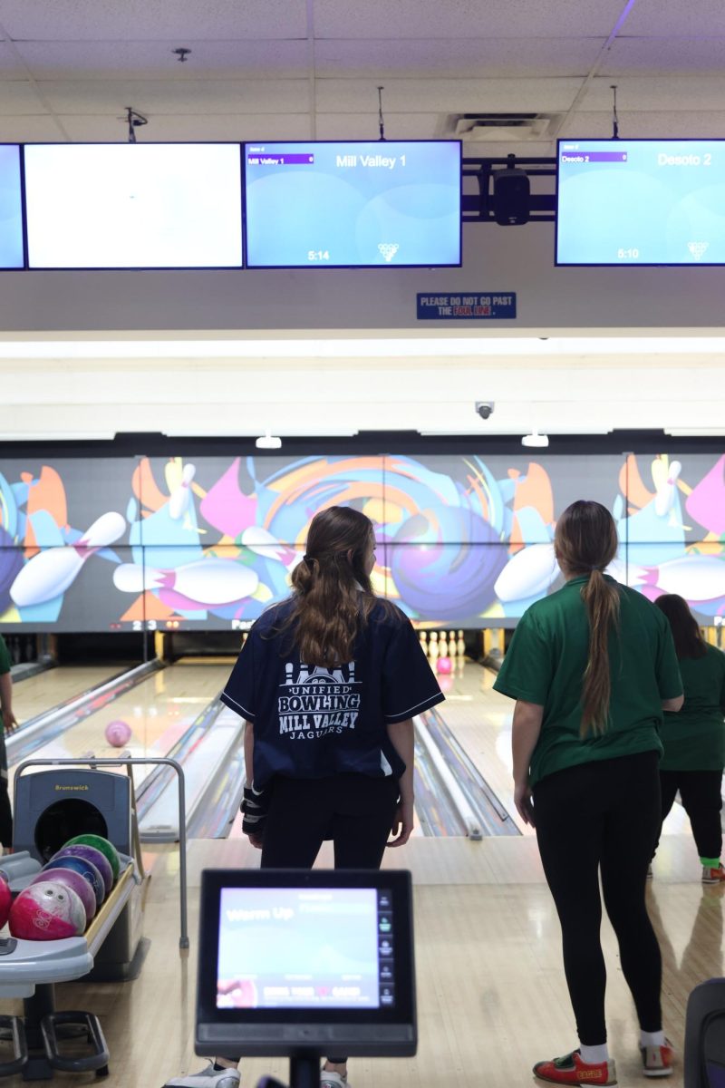 Junior Layla Gonzalez talks to a member of DeSoto's bowling team before the tournament begins. 