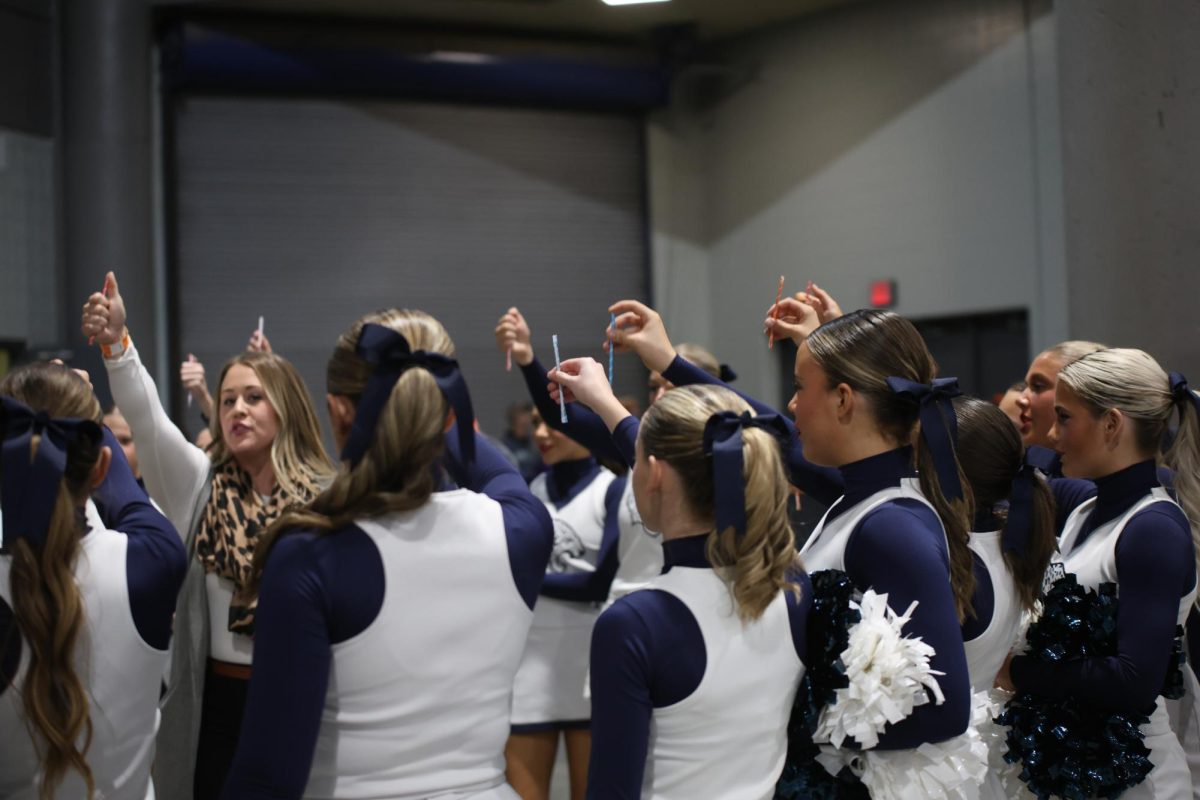 Holding their pixie sticks in the air, the cheer team chants “Every single effort matters.”