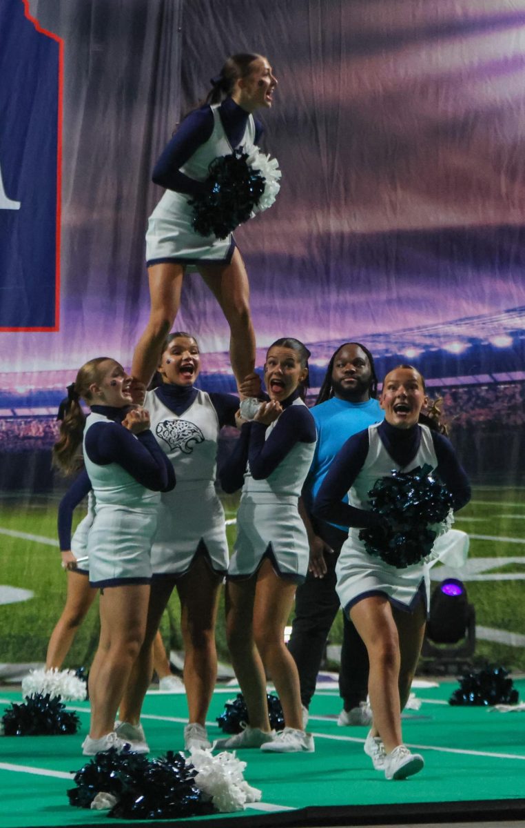 All together, the cheer team keeps the energy up until the last second of their routine.
