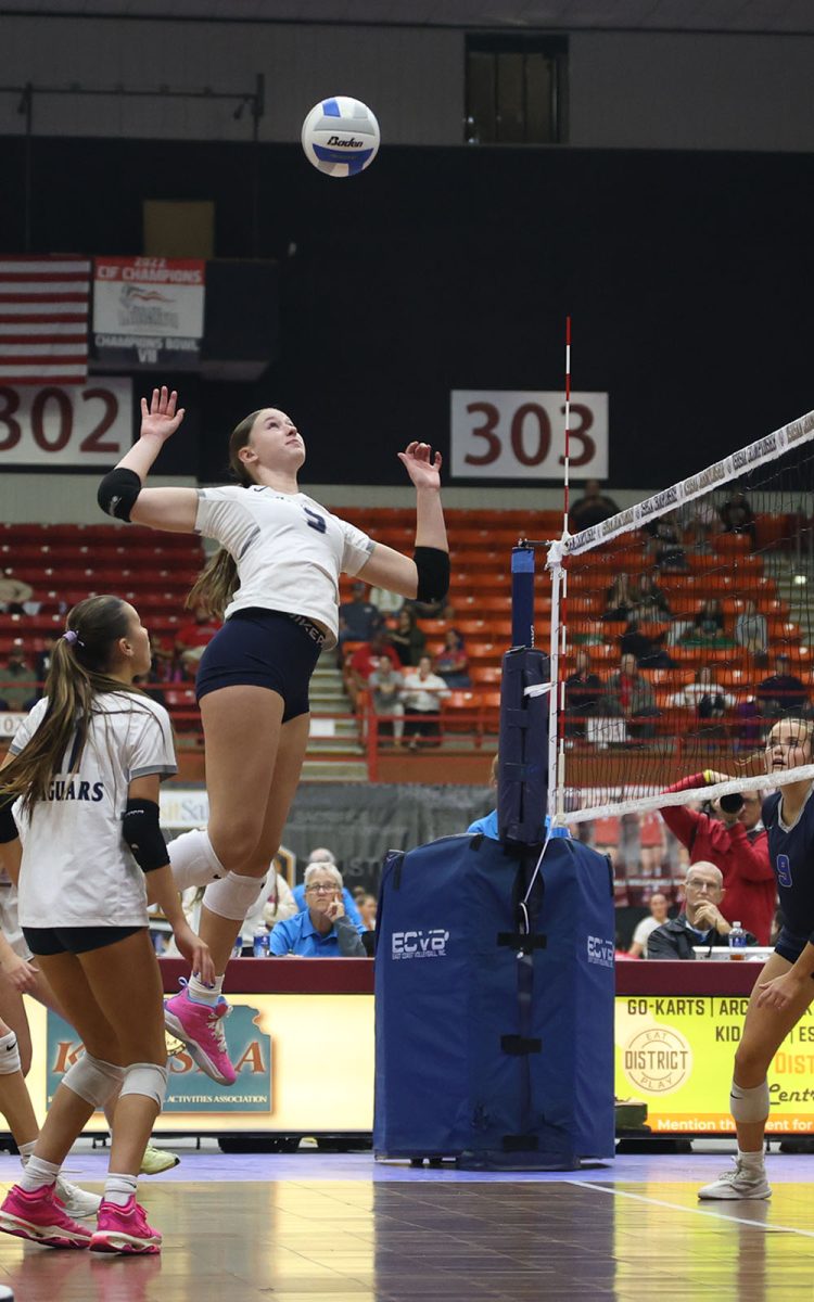 Senior Saida Jacobs looks to get a kill in the final pool play match of the day against Olathe West.