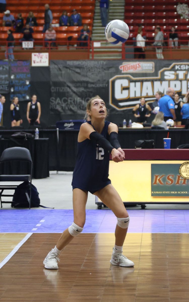 With her arms out in front, sophomore Corinne Schwindt prepares to pass to a teammate.