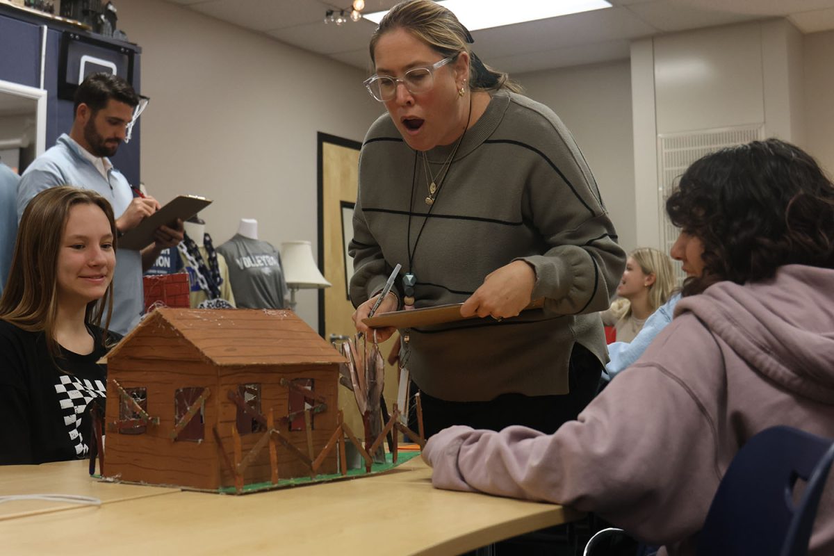 Selected as a judge Mrs. Porter is amazed at the work done on this house as juniors Saige Pretz and Victoria Comelie describe it.