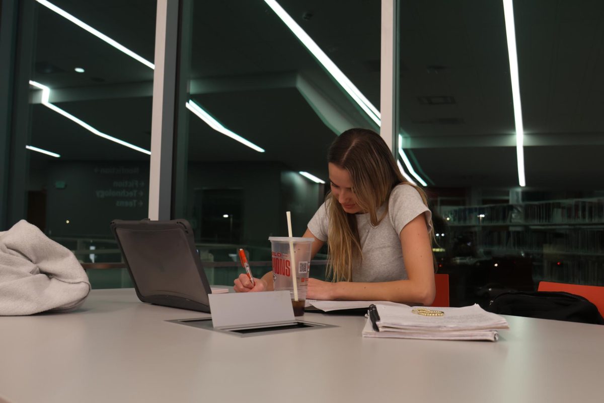 Staying focused, Junior Miley Strathman works on her homework.