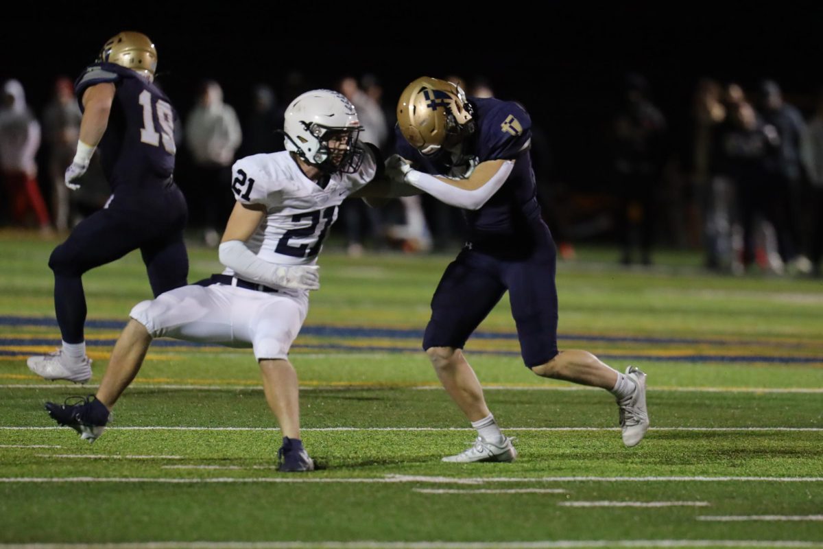 Senior Clayton Sondgeroth blocks the opponent. 