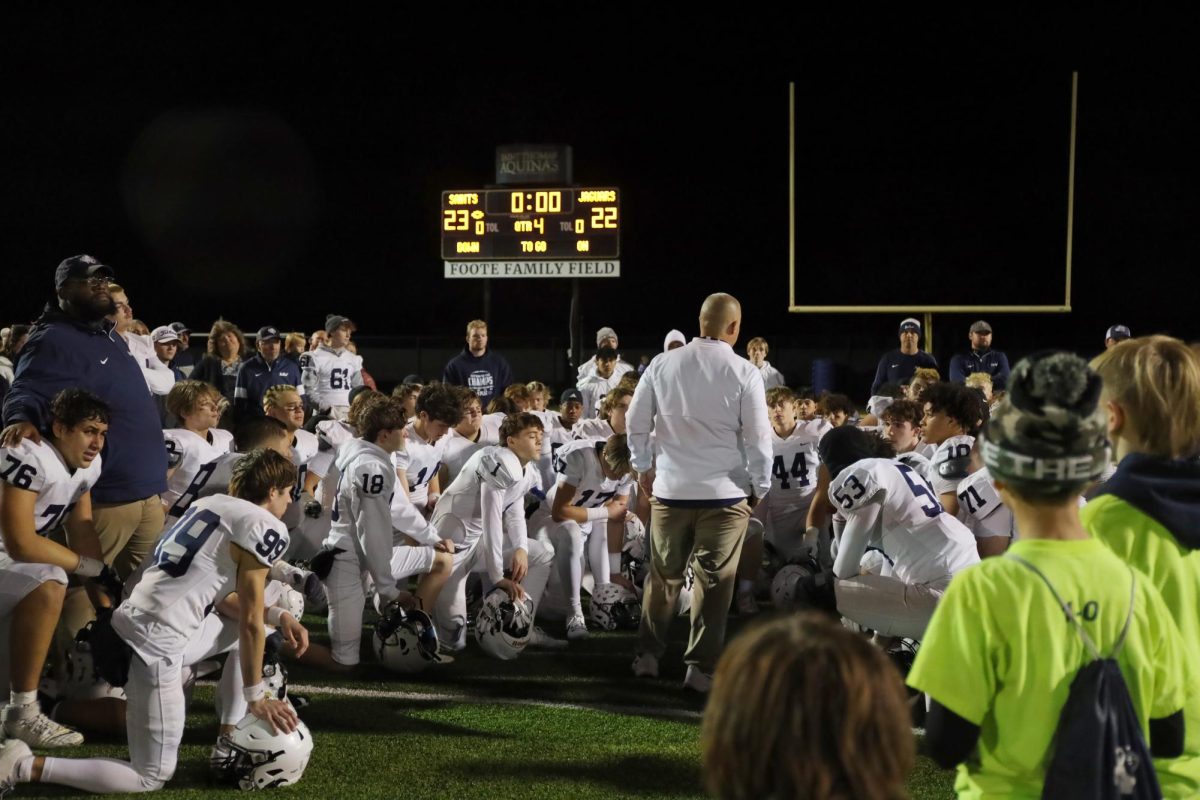 Post game, the team listens to Head Coach Joel Applebee's speech.