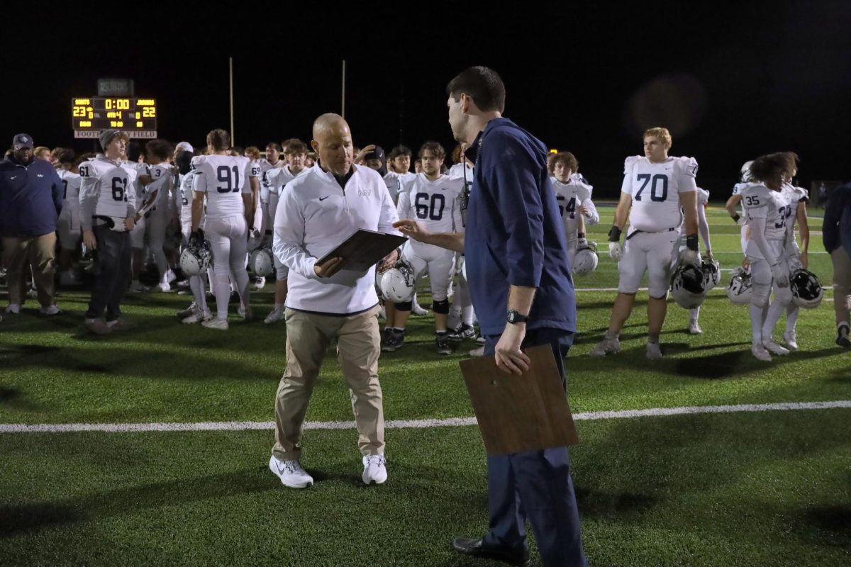 After the game, Head Coach Joel Applebee accepts the Sectional Runner-up trophy. 