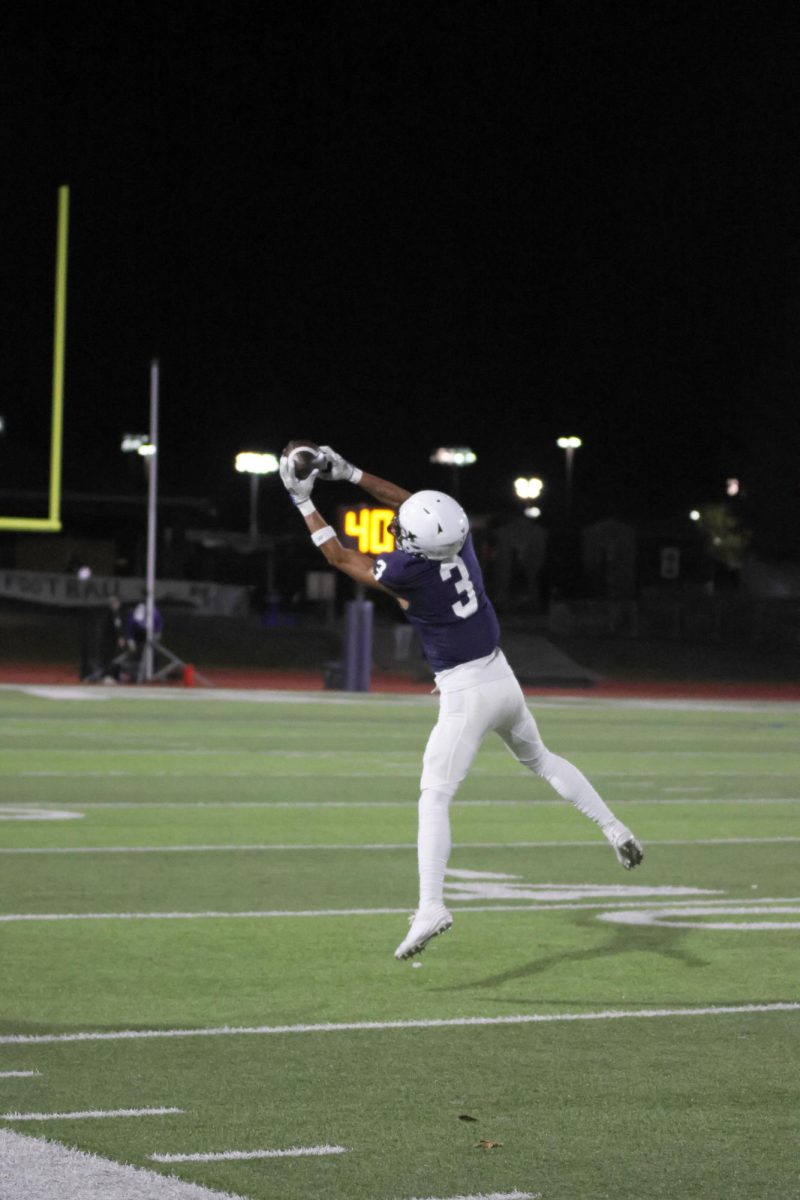 Senior Desmond Williams reaches out and completes an inbounds catch. 