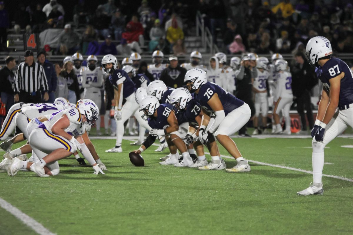 Senior Zach Zaldivar gets ready to snap the ball and start the play. 