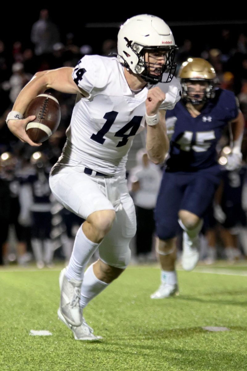 Senior Connor Bohon races down the field in an attempt to score a touchdown.