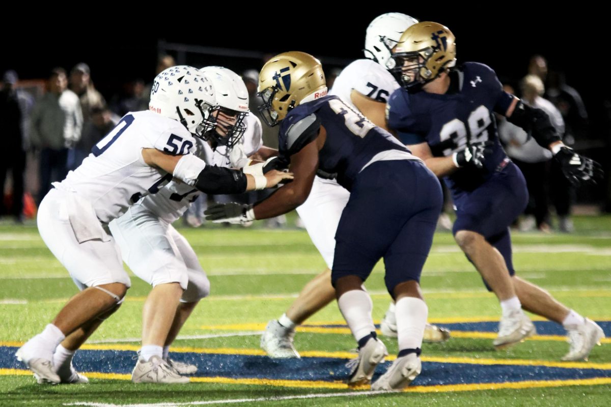 Senior Zach Zaldivar helps block an opposing player during the second quarter of the game.