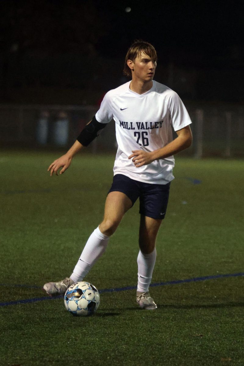 Junior Camden Dick looks for an open teammate to pass the ball to.