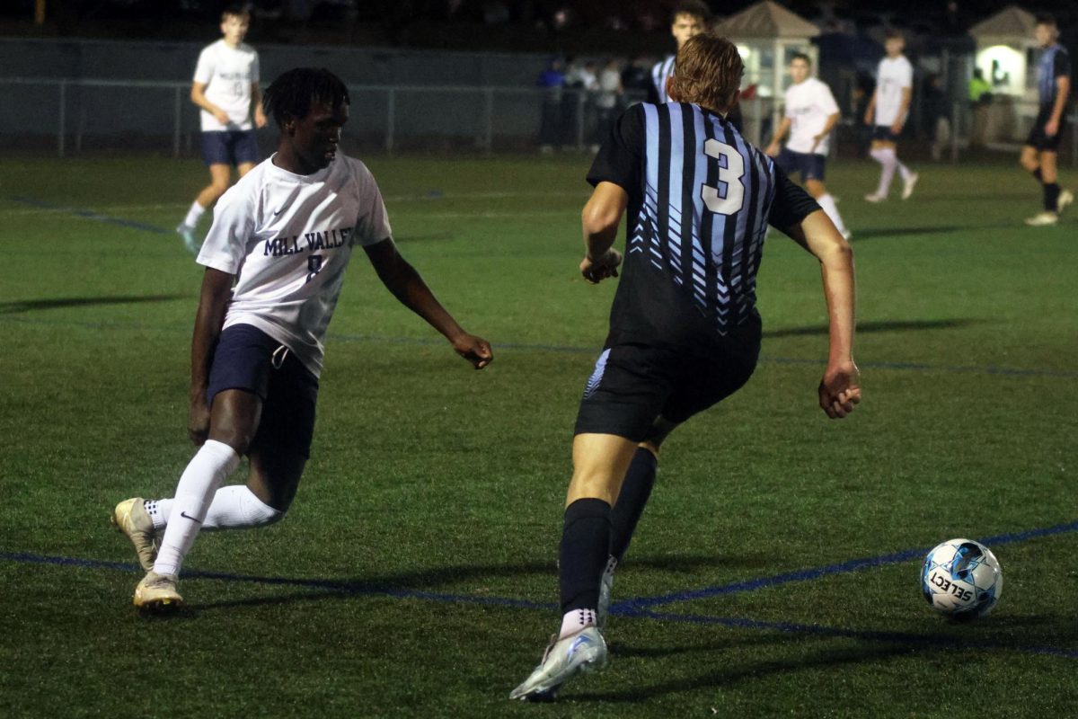 Junior Cayden Rotich closely follows the ball in order to steal it from his opponent. 