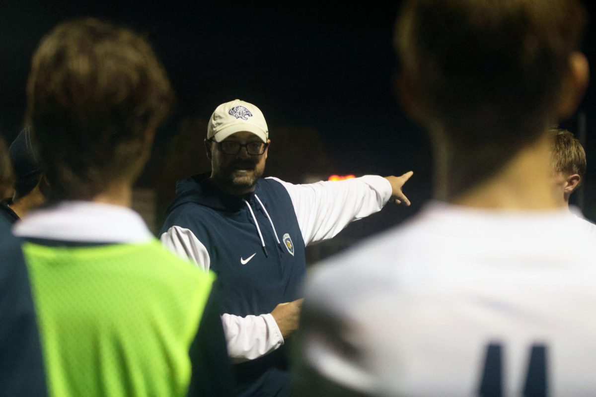 Coach Justin Crawford gives a half time pep talk to the team after a 0-0 first half.