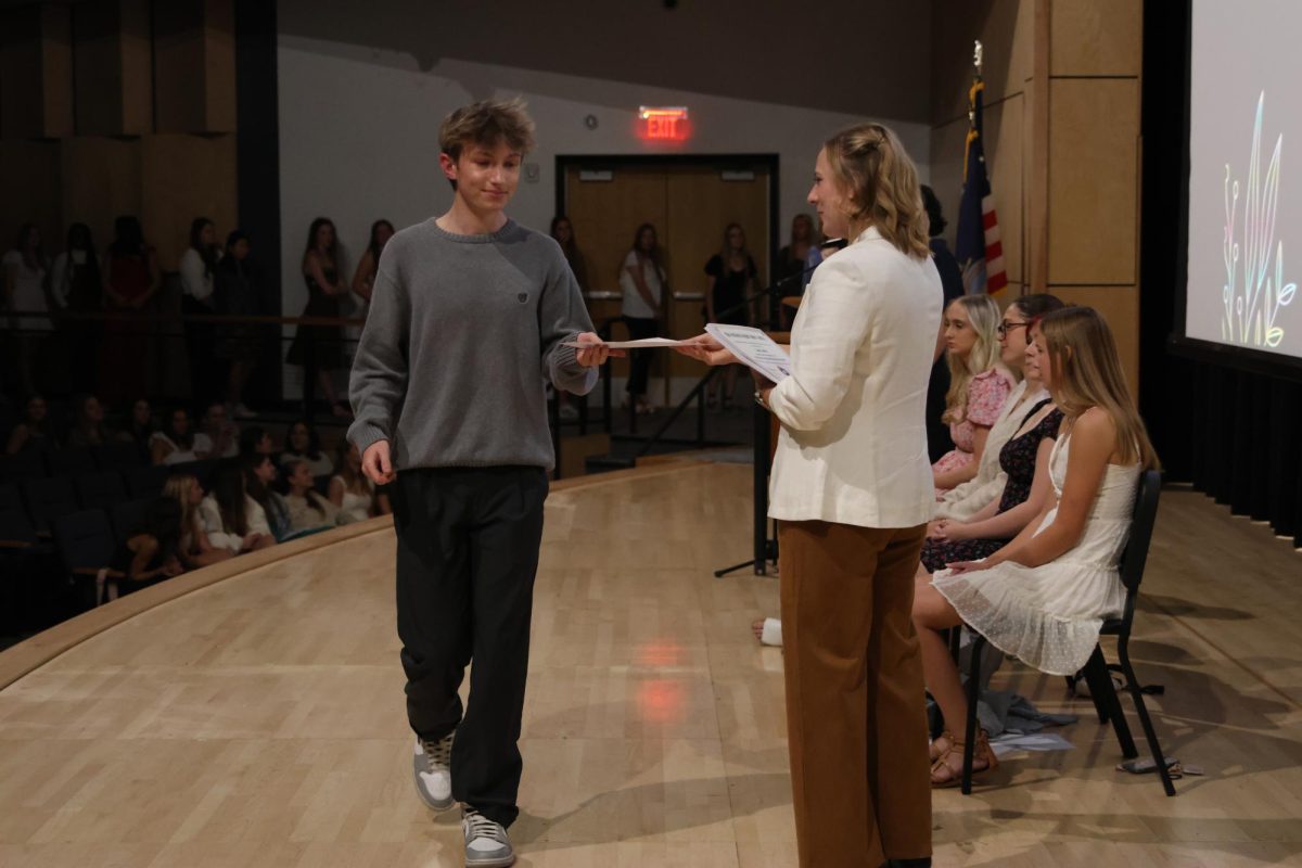 Junior Gus Goetsch accepts his certificate on Nov. 12. 