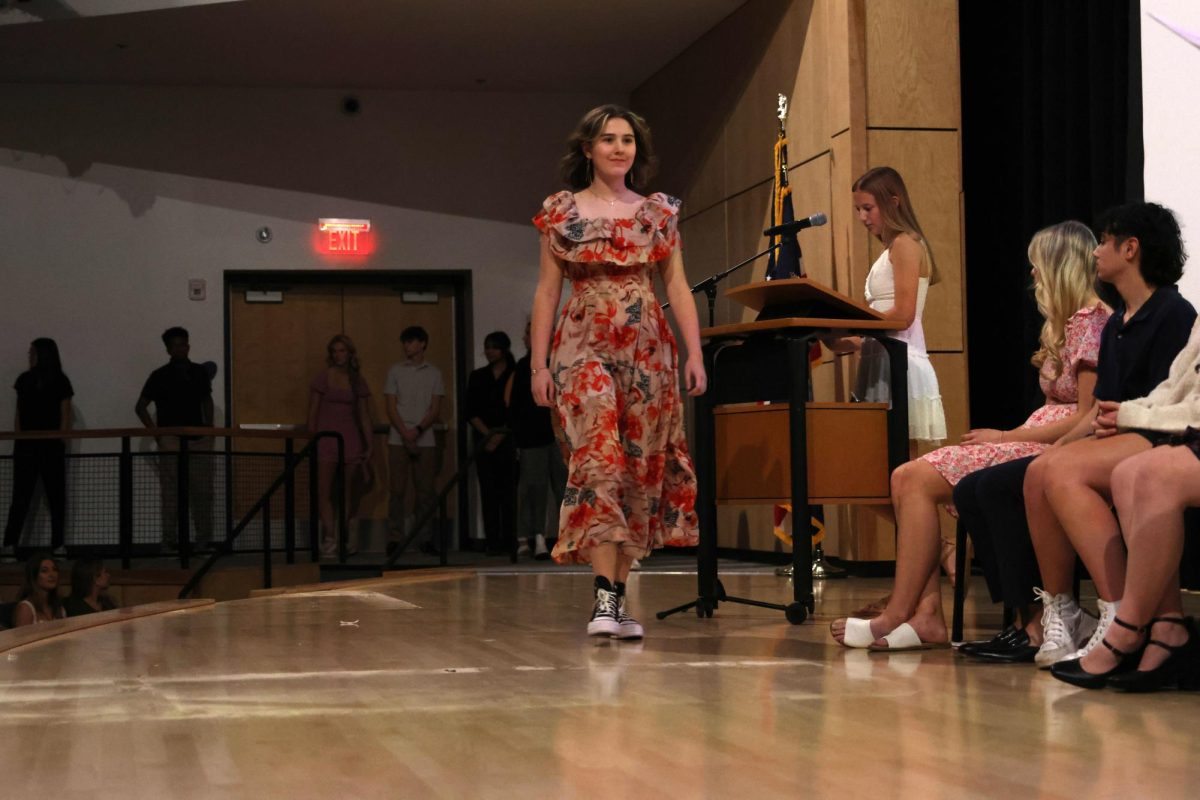 Junior Katie Shinkle walks down the stage to receive her certificate on Nov. 12. 