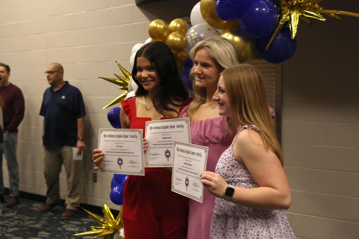 Junior Ava Lucht, junior Brynlee Sword and sophomore Amanda Makalous hold their certificates up for a photo on Nov. 12. 