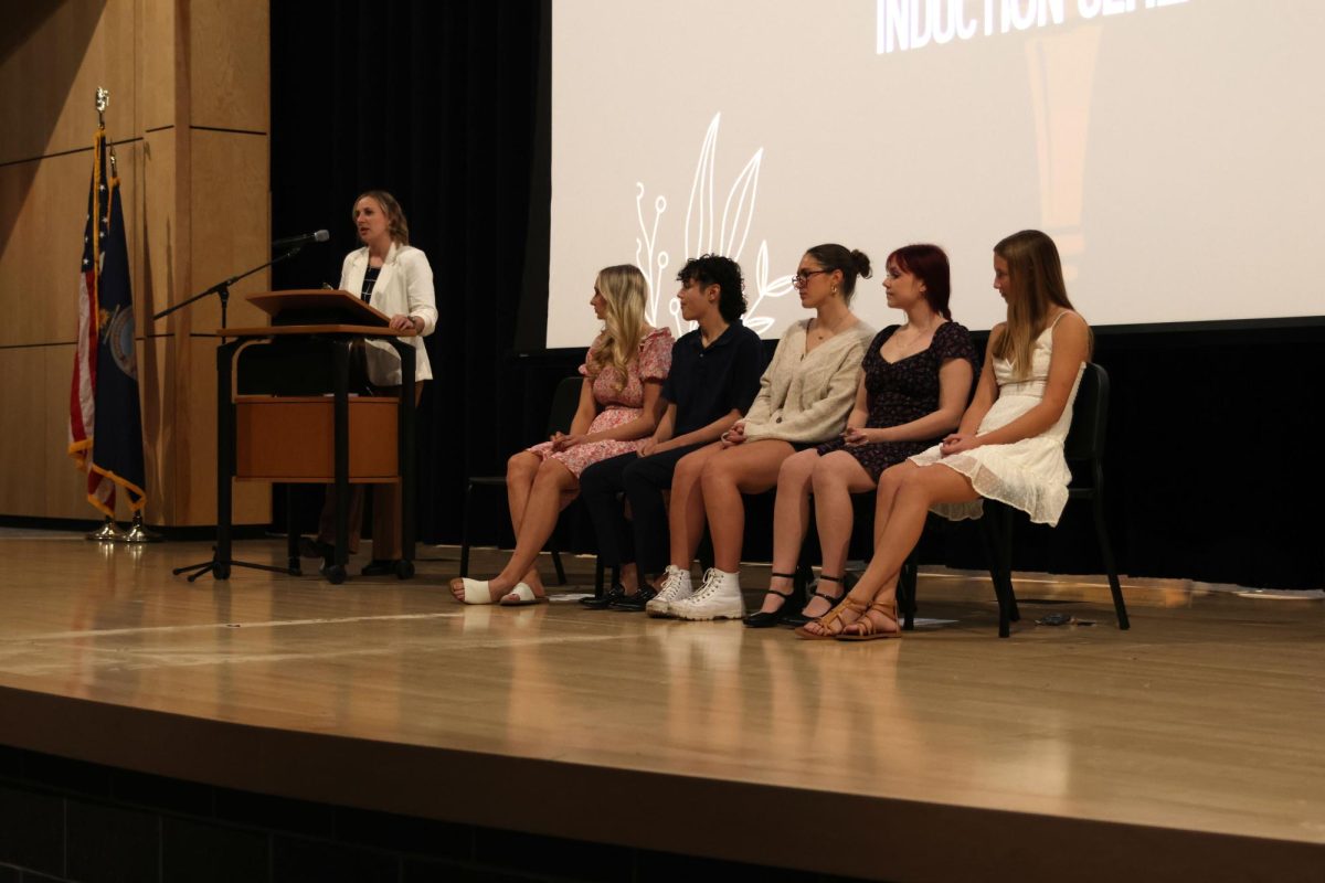 Teacher Page Anderson recites her speech to the audience on Nov. 12. 