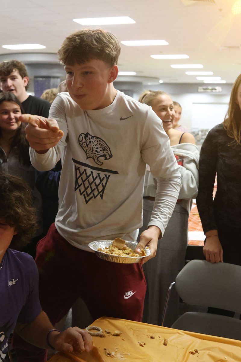 After winning the pie eating contest, junior Grant Kuchynka celebrates his victory. 

