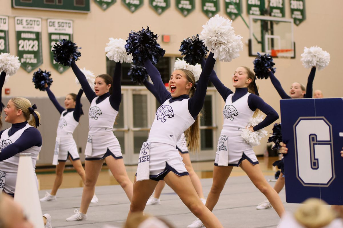 Performing at the District Showcase, junior Sydney Epperson put on a routine for parents and students.