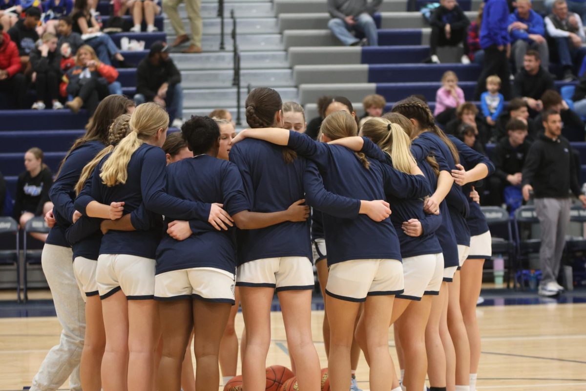 Before the game begins, the players call a team huddle.