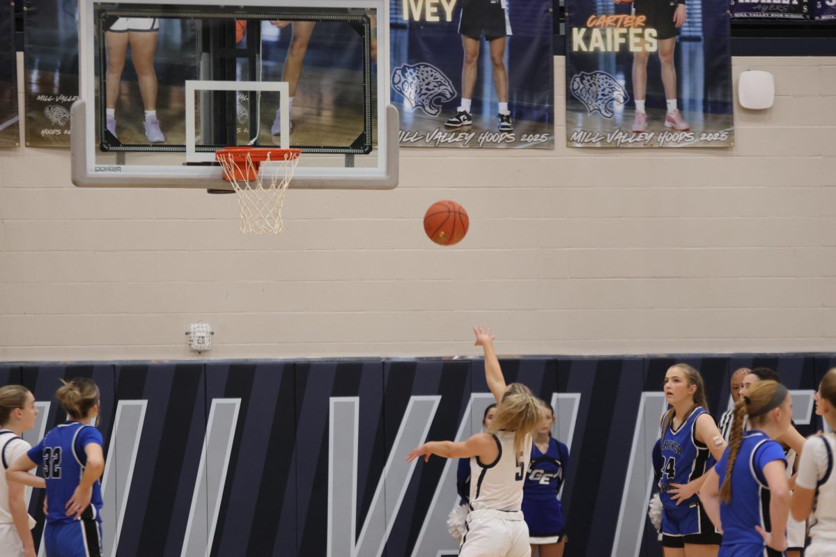 Senior Josie Benson makes the basket.