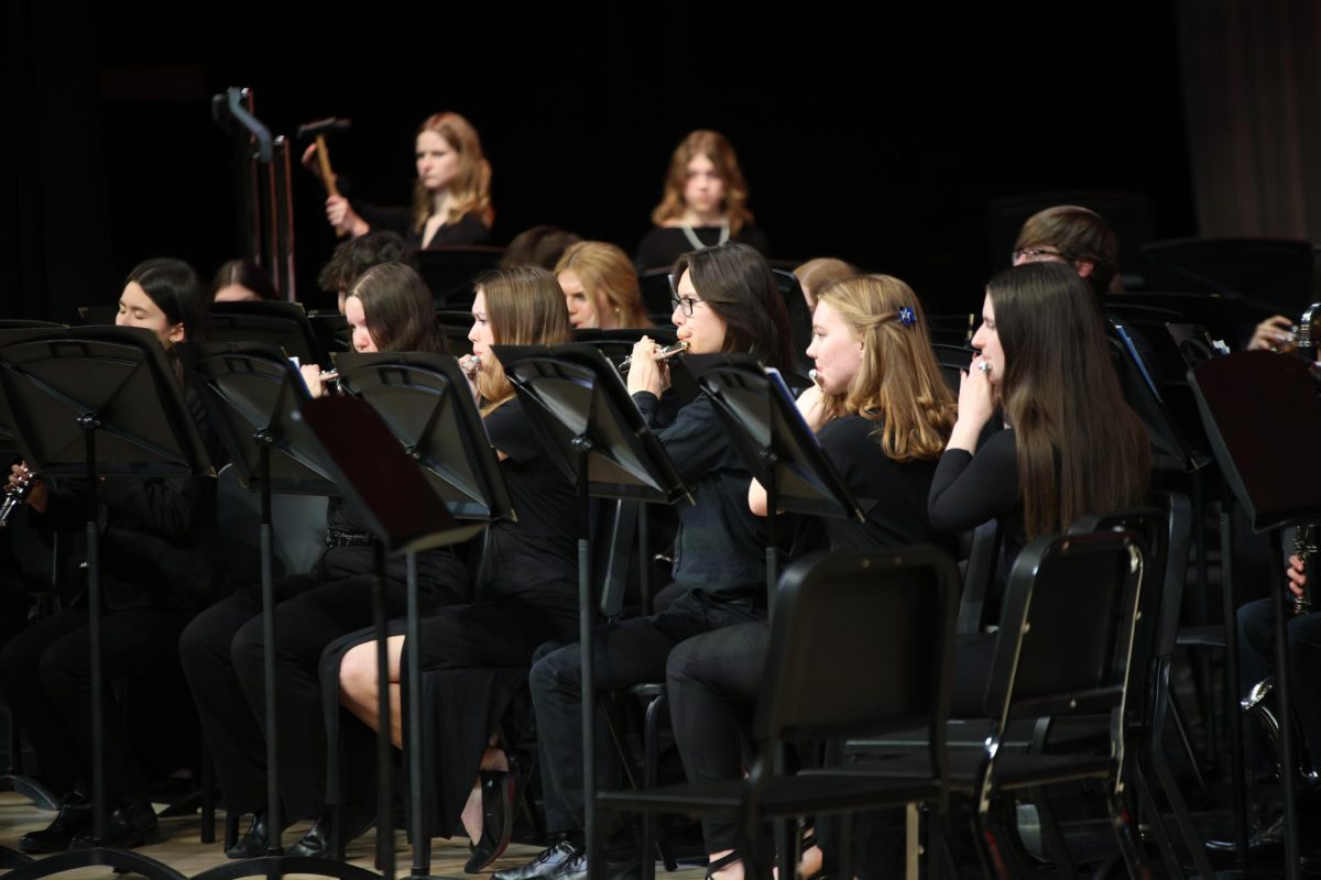 Along with the other flautists, freshman Calder Hsu plays the flute.