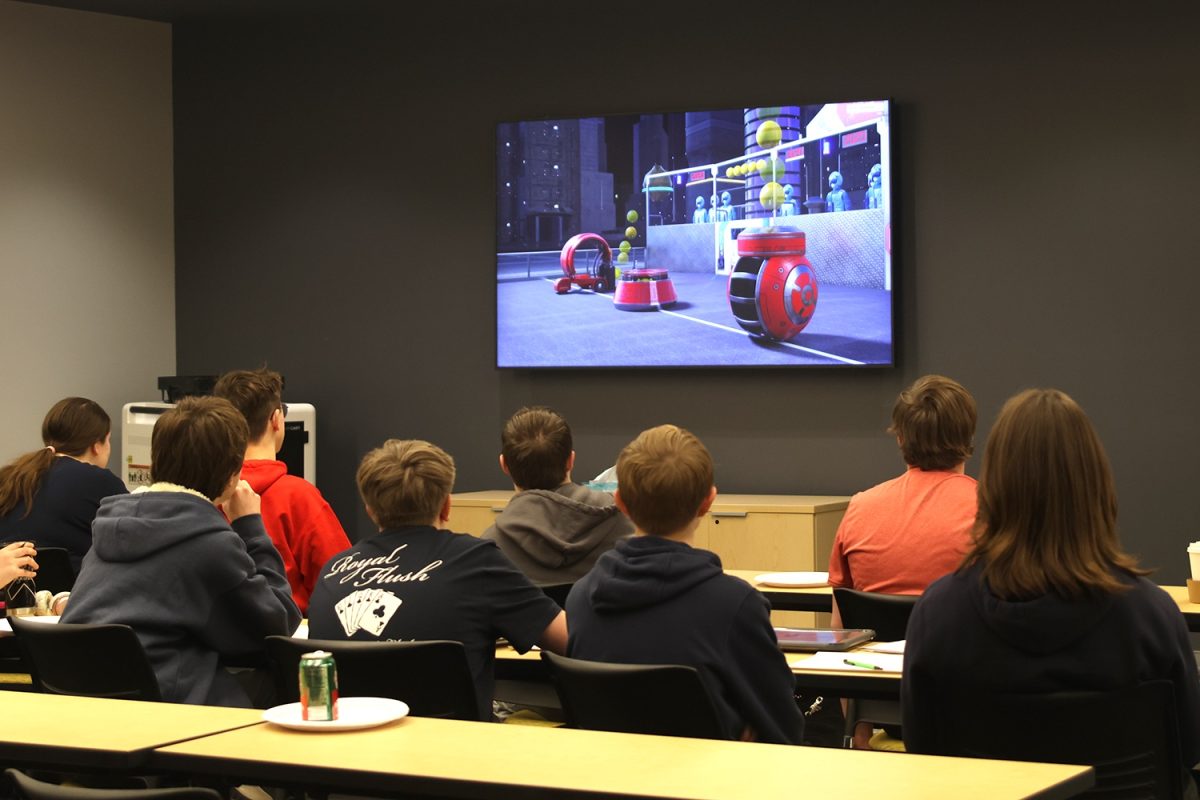 Observing the game reveal, students watch to know what they need to do.