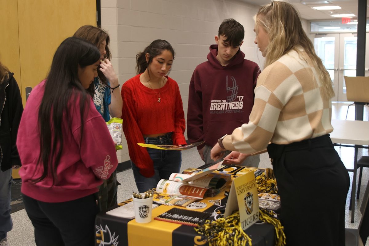 Talking to the sponsor for Fort Hays State University, sophomore Azaria Vasquez talks about what path she wants to take in college, Thursday Oct. 31.
