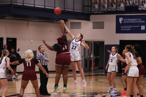 Junior Paige Roth jumps in the air attempting to knock the ball to her teammates Tuesday Nov. 10.  