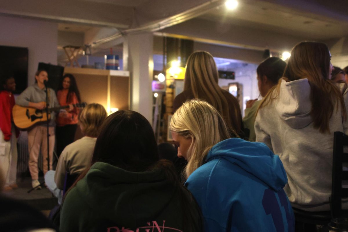 Students watch as people perform during StuCo's open mic night on Tuesday Dec. 10.  