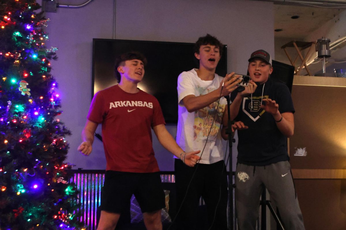 Looking at the lyrics, juniors Gavin Hurt, Reece Riedel and Elliot Fischer sing "Unwritten" by Natasha Bedingfield, Tuesday Dec. 10  